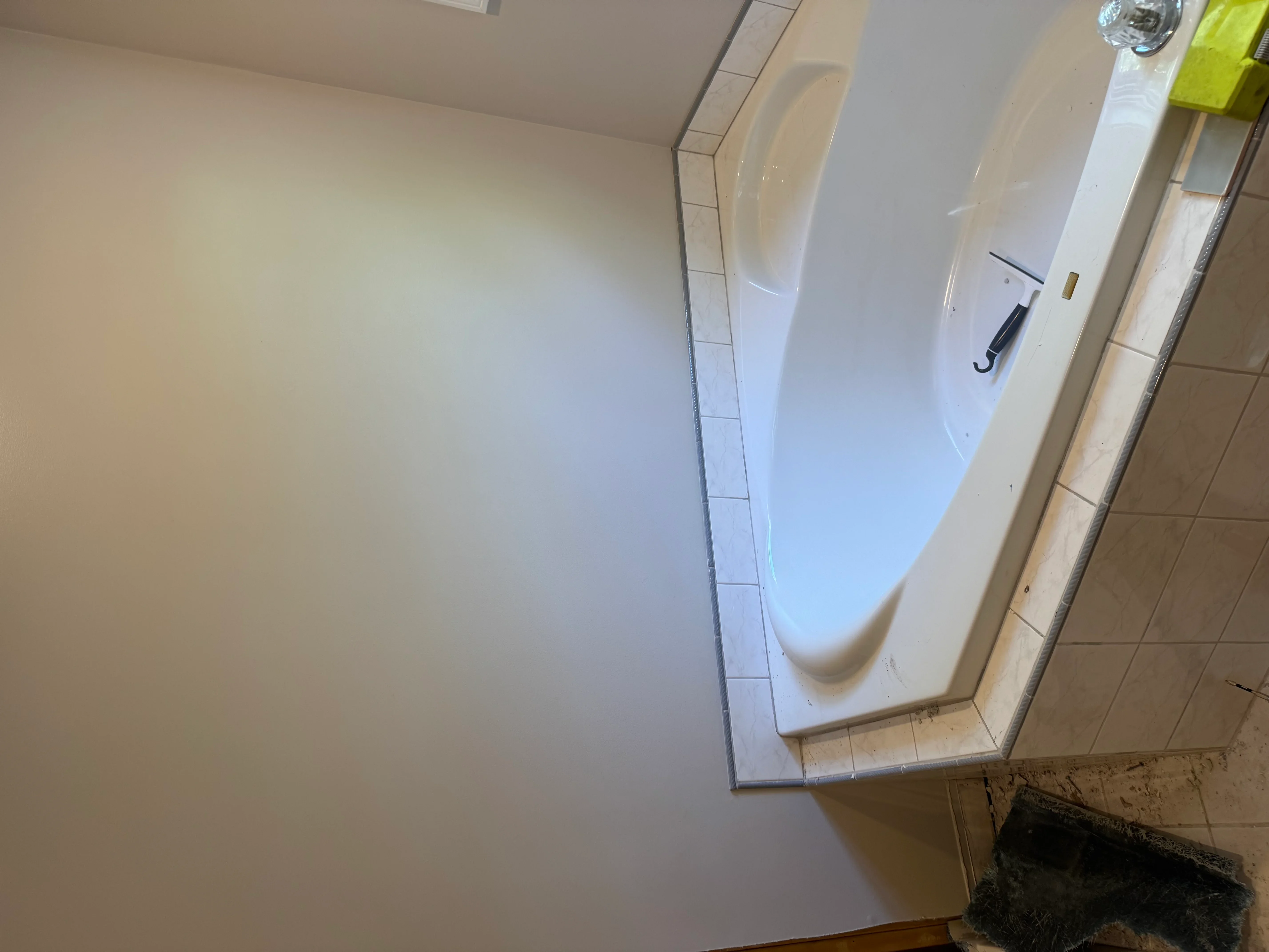 Bathroom with new ceramic tile flooring, finished drywall, and painted walls