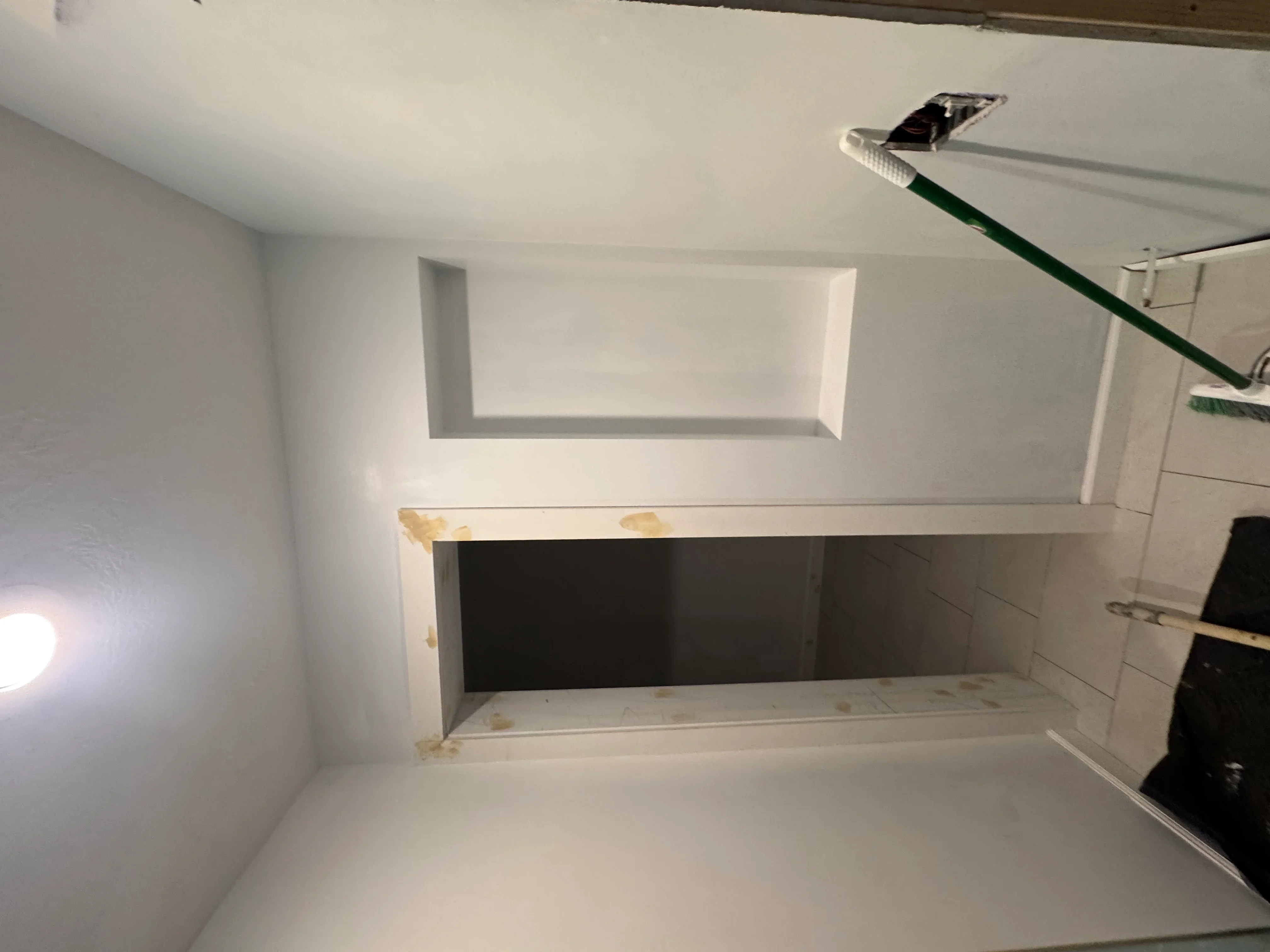 Finished drywall walls and ceiling with taped joints and recessed opening in residential interior